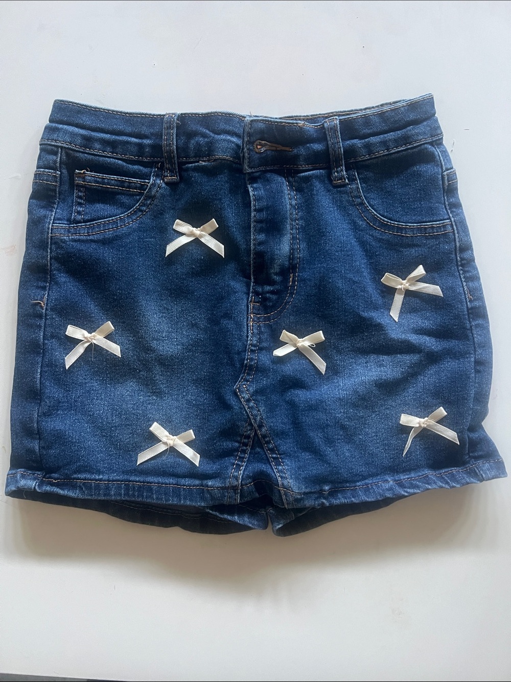 Girls' Dark Blue Denim Skort with White Bow Accents